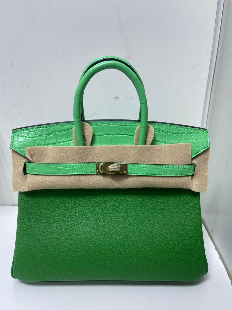 Herm**s crocodile bags.