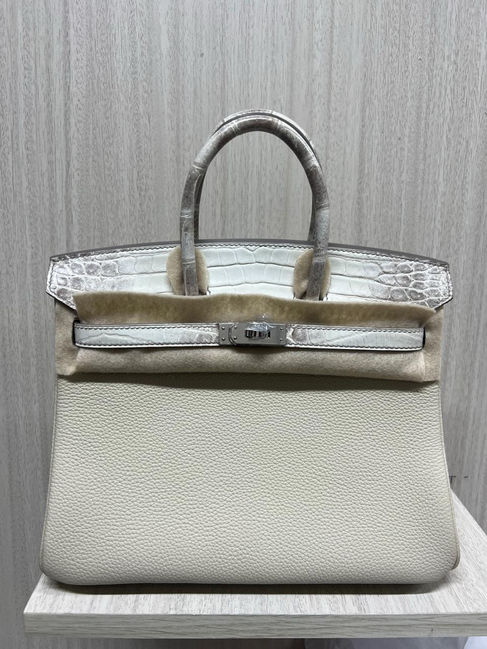 Herm**s crocodile bags.