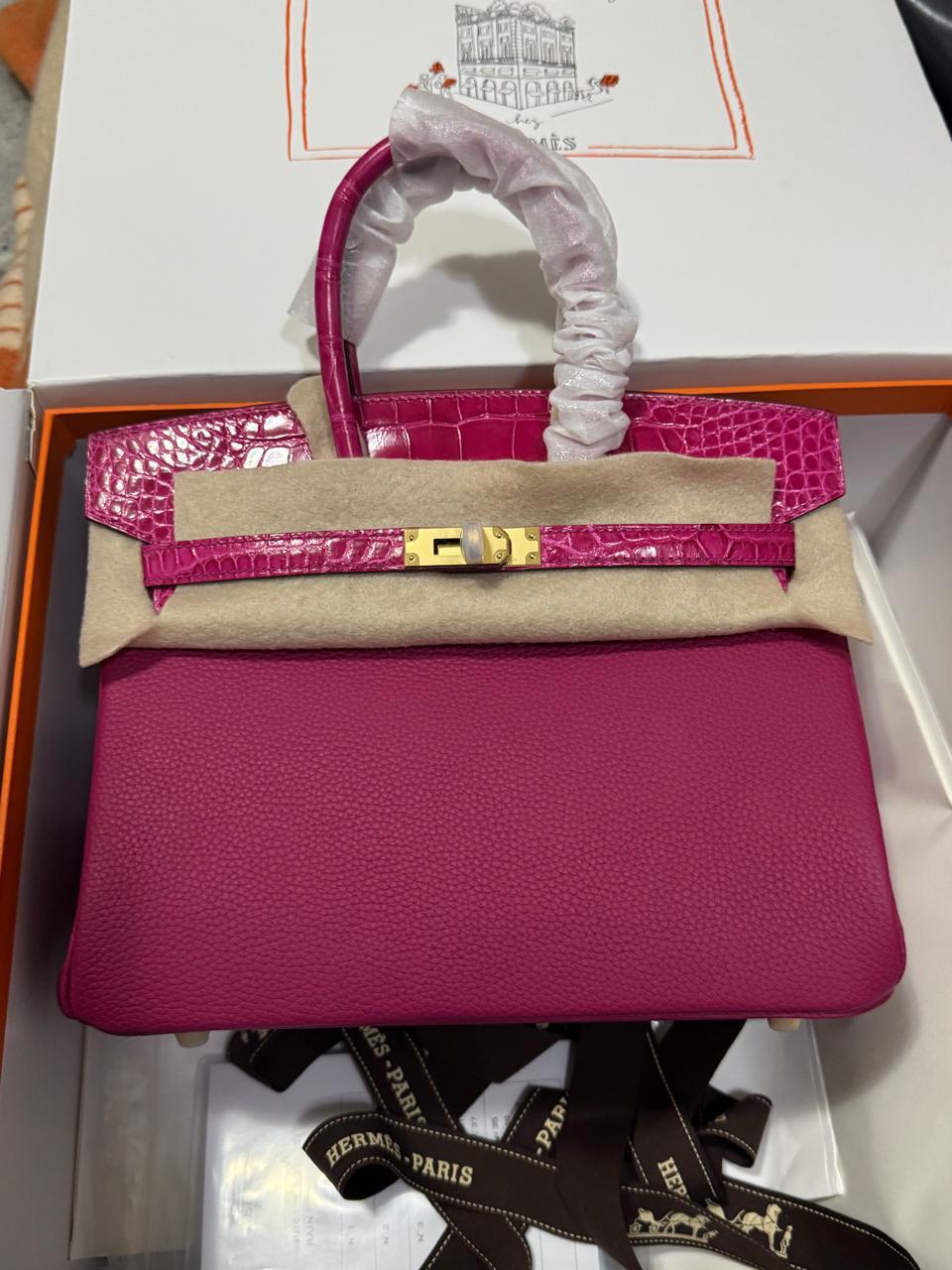 Herm**s crocodile bags.