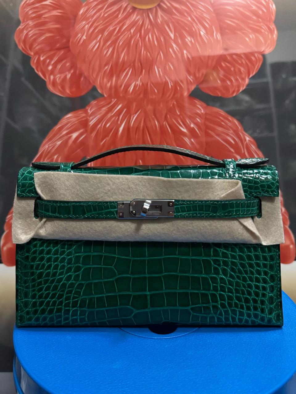 Herm**s crocodile bags.