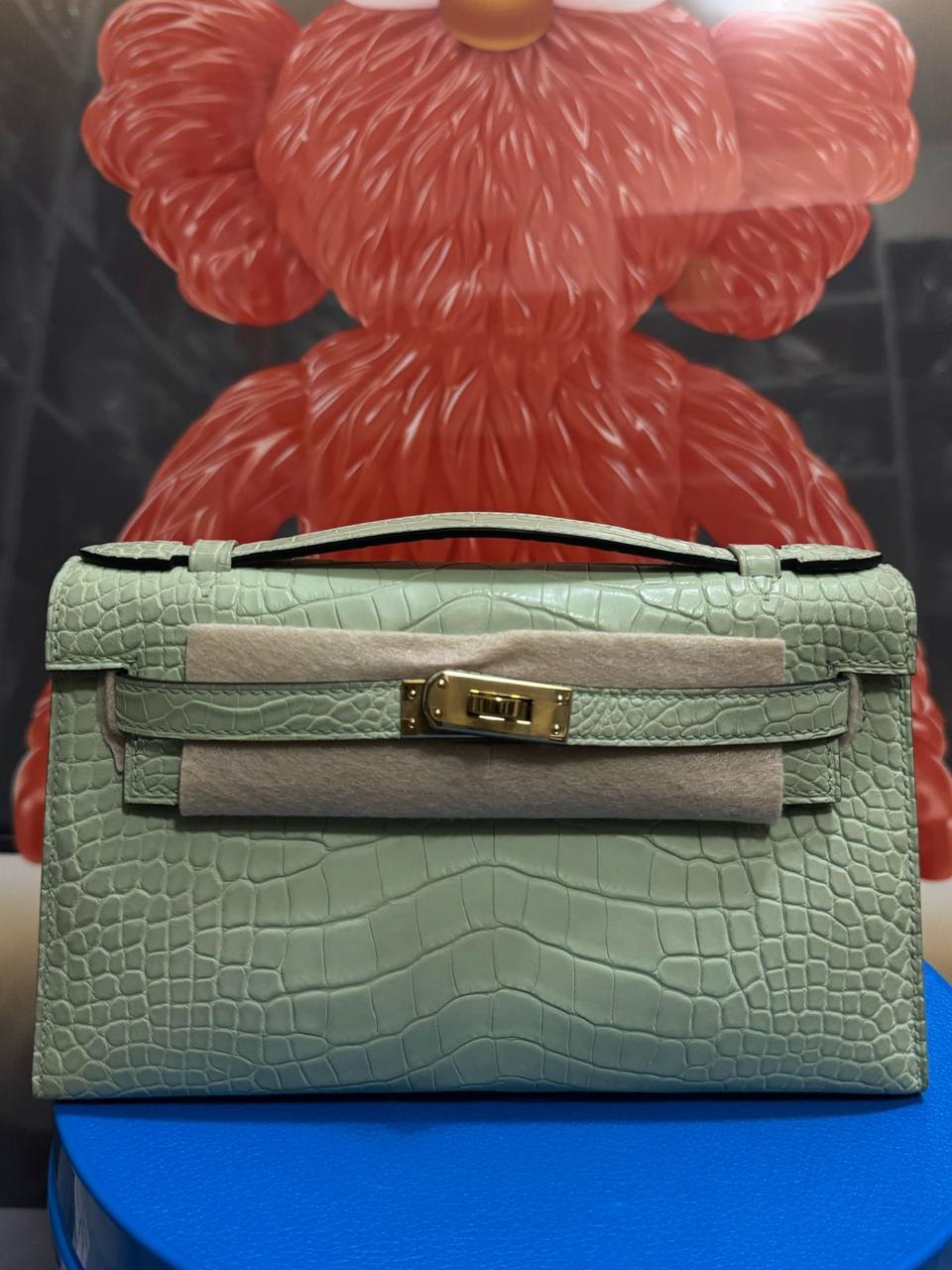 Herm**s crocodile bags.