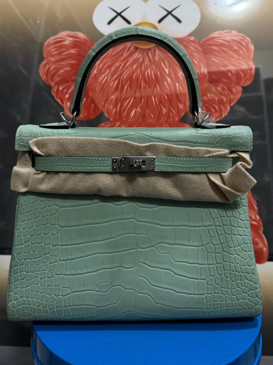 Herm**s crocodile bags.
