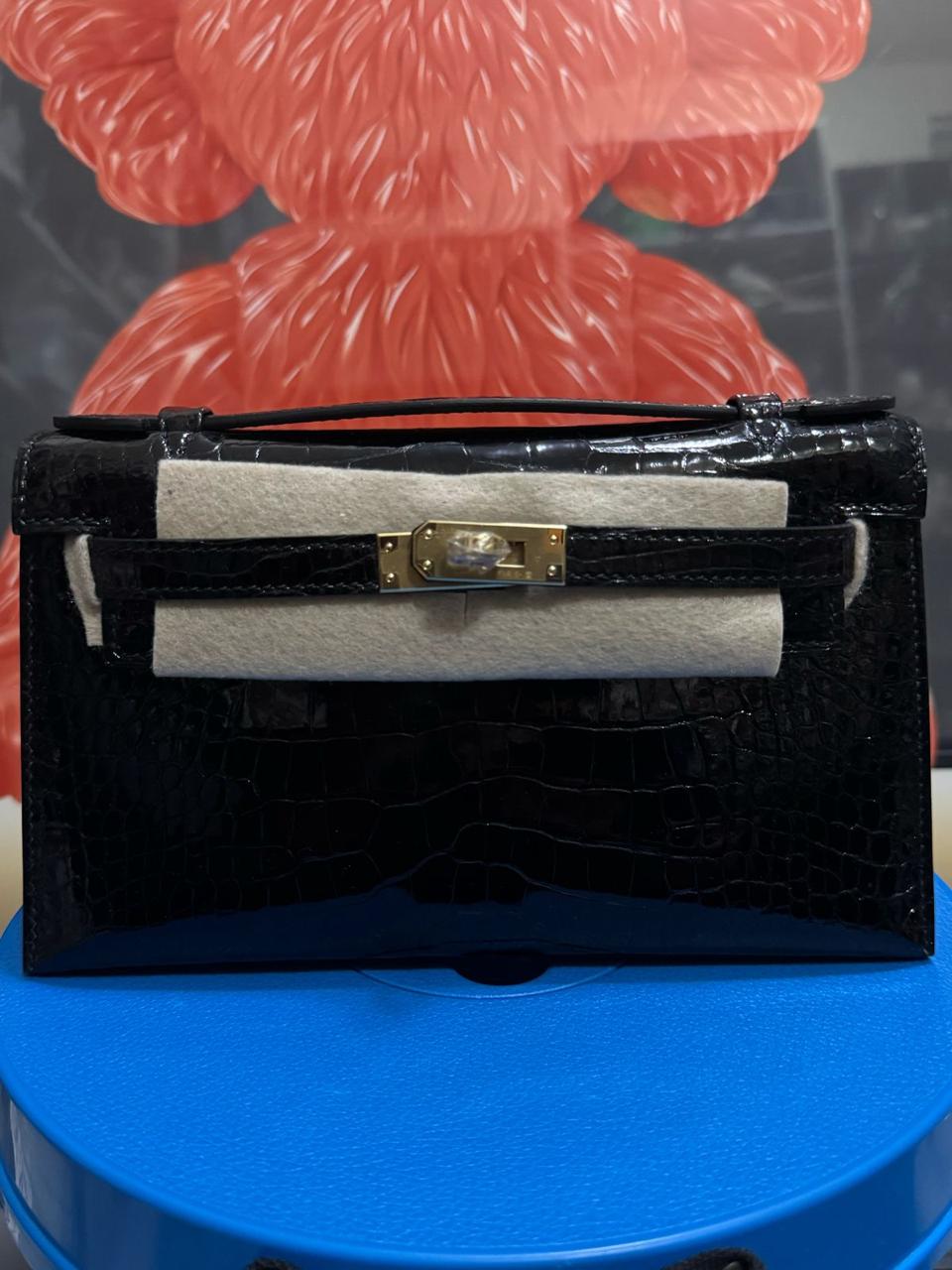 Herm**s crocodile bags.