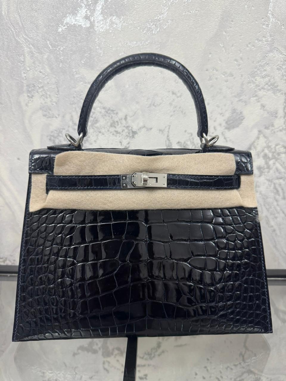 Herm**s crocodile bags.