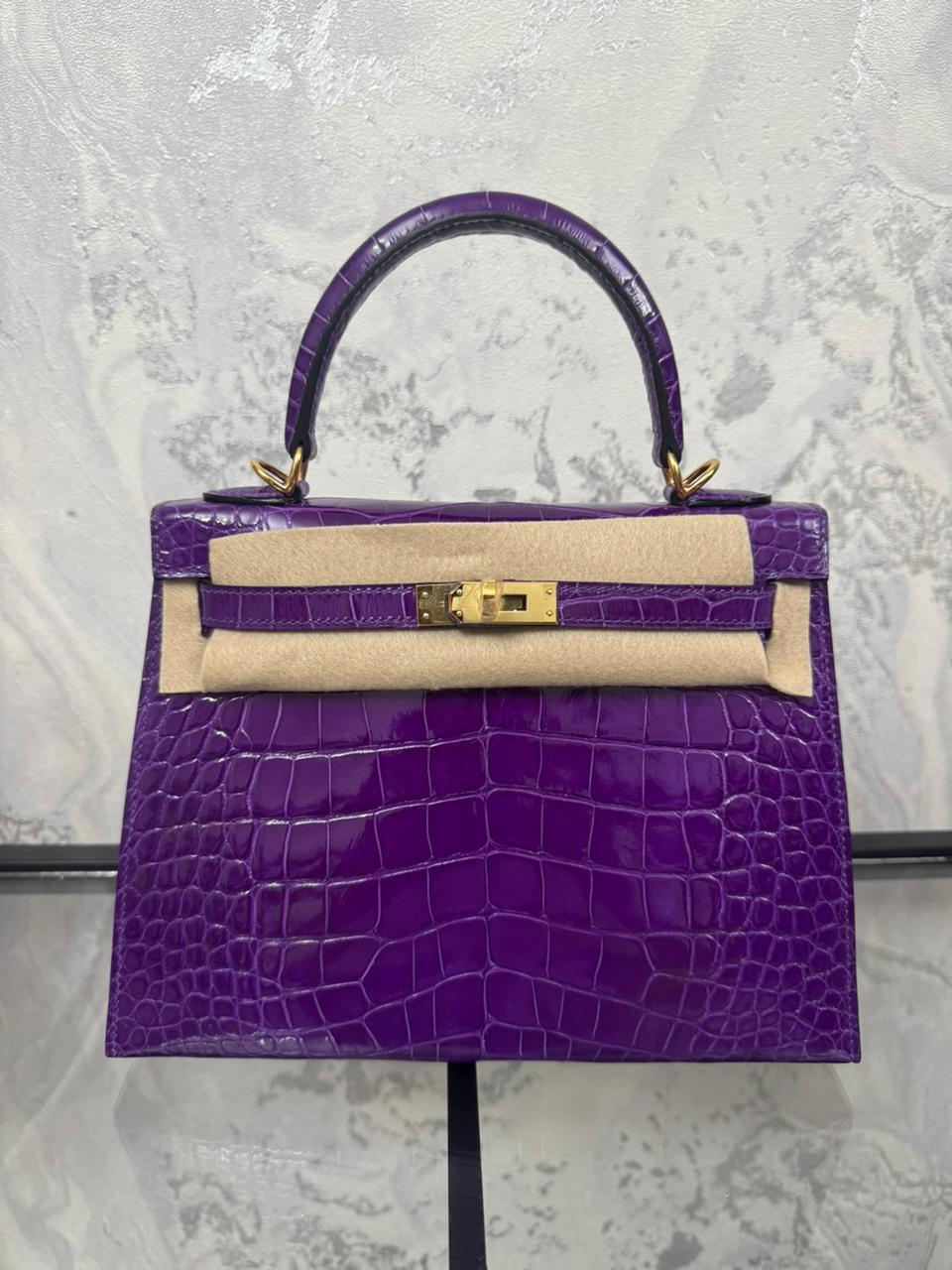 Herm**s crocodile bags.