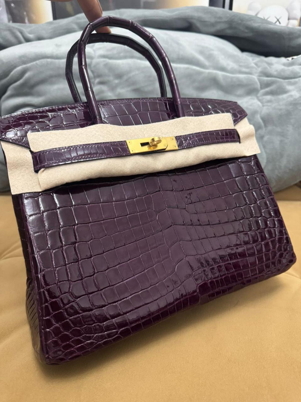 Herm**s crocodile bags.