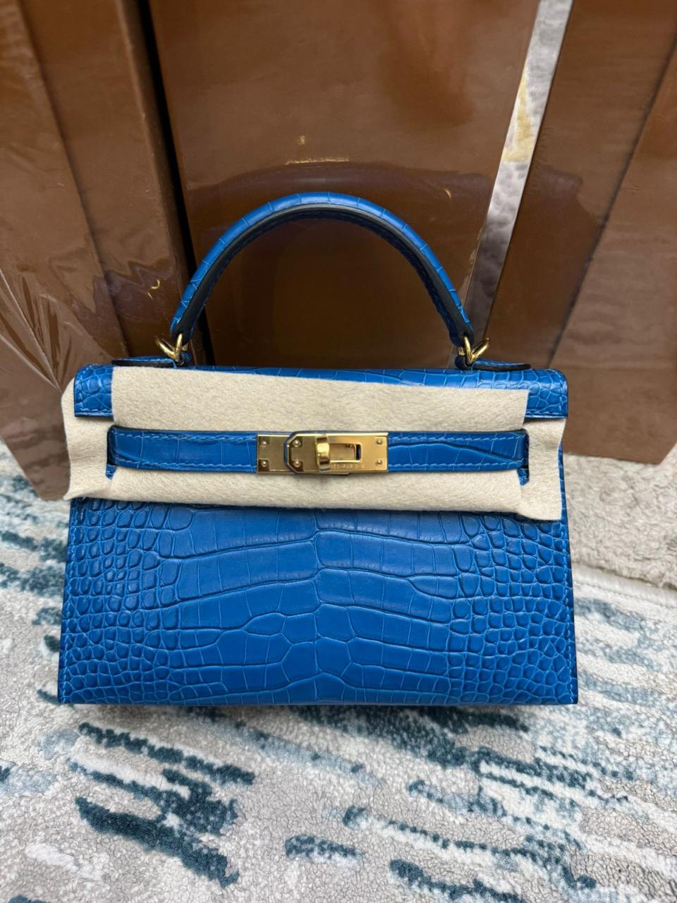 Herm**s crocodile bags.