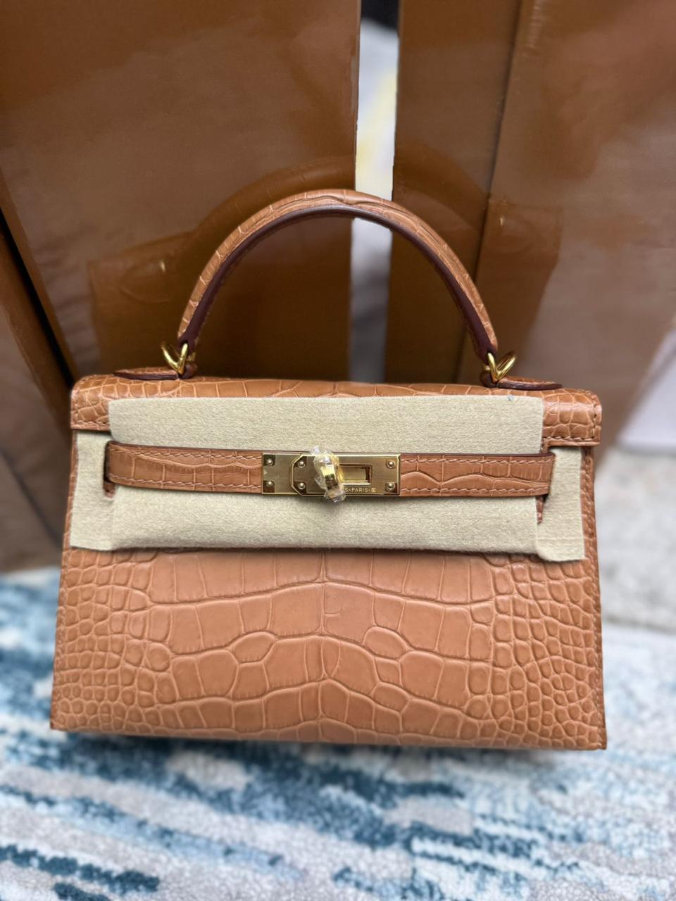 Herm**s crocodile bags.