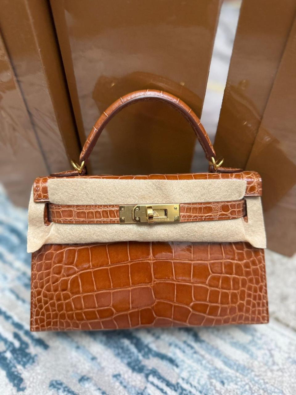 Herm**s crocodile bags.