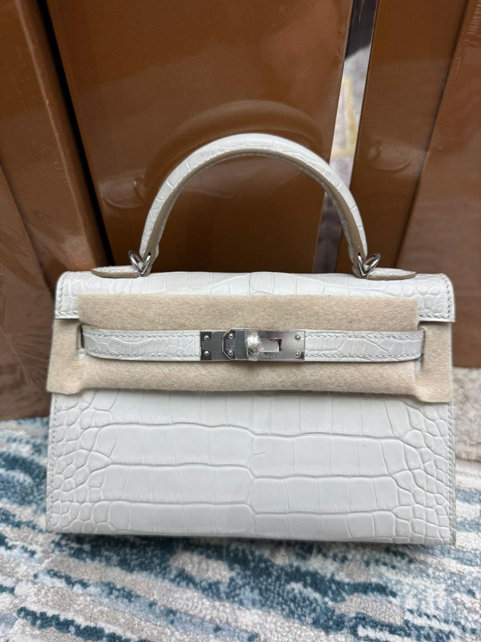 Herm**s crocodile bags.