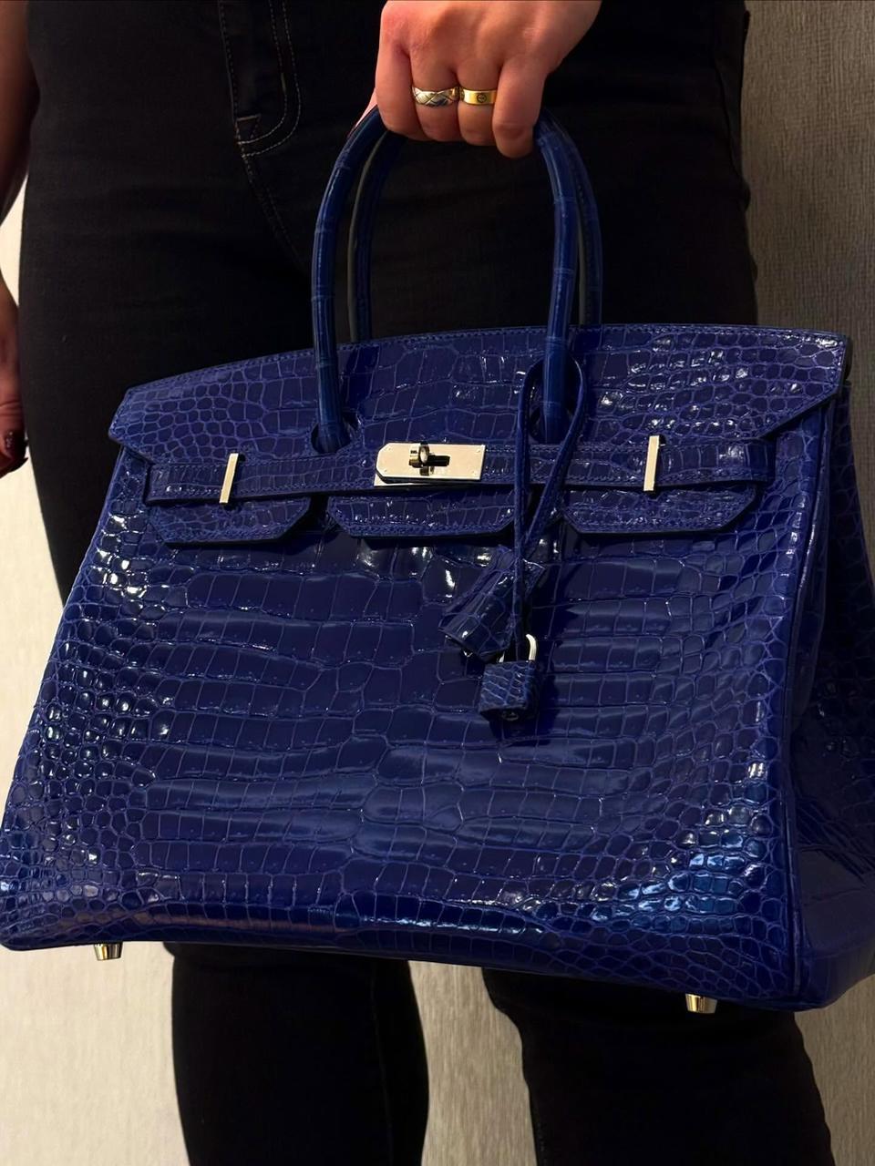 Herm**s crocodile bags.