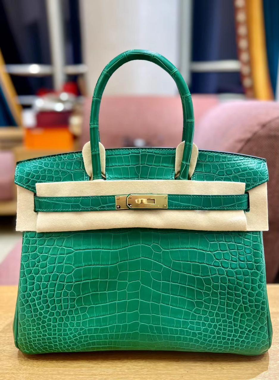 Herm**s crocodile bags.