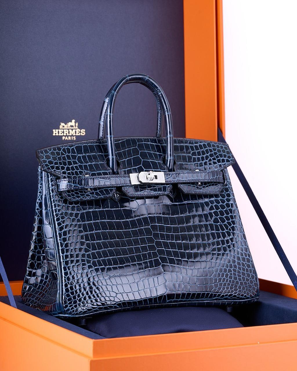 Herm**s crocodile bags.