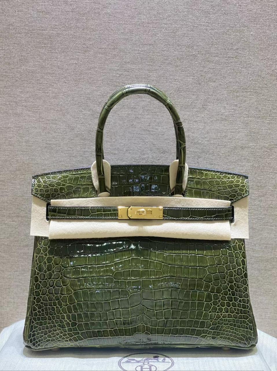 Herm**s crocodile bags.