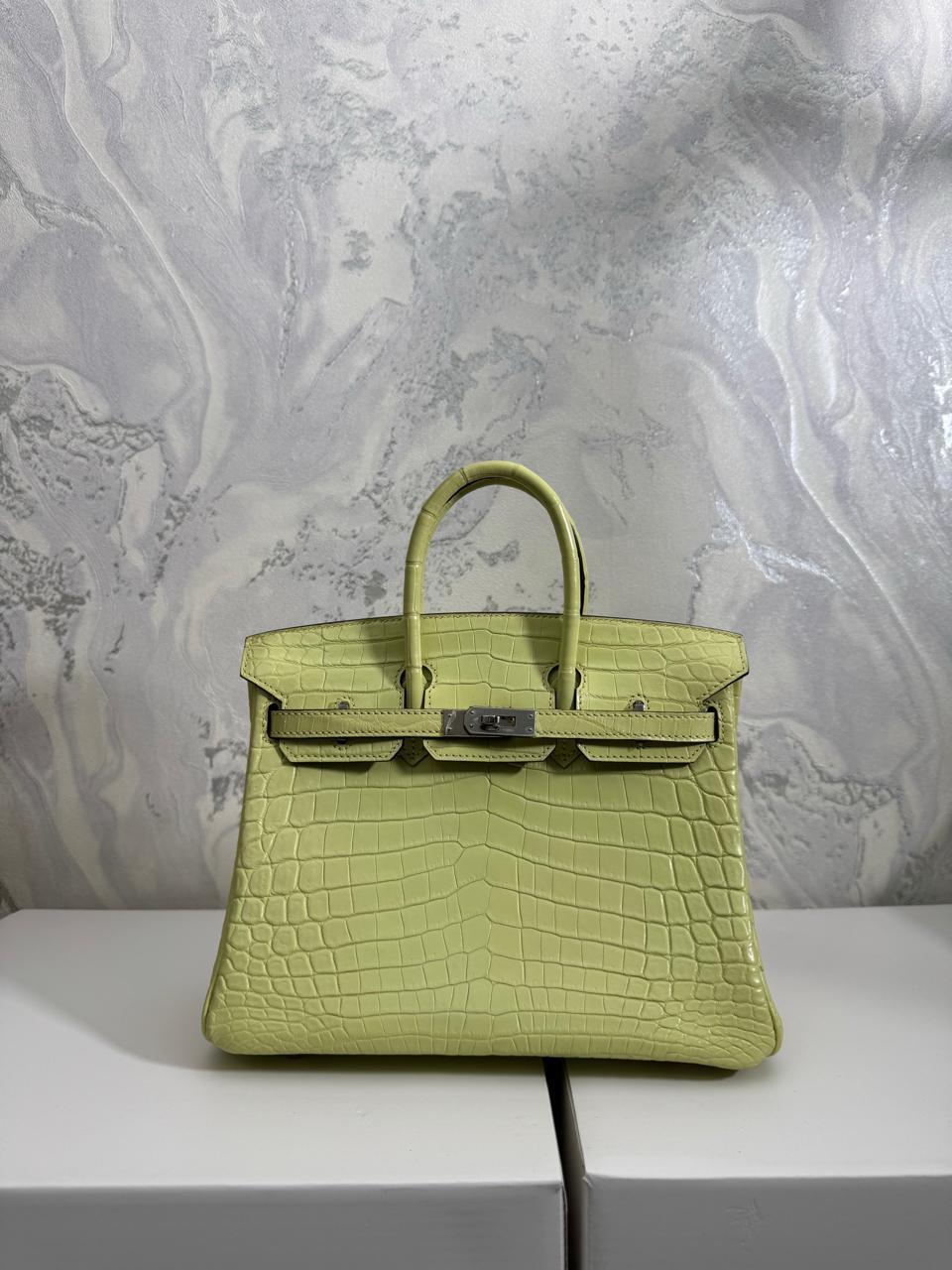 Herm**s crocodile bags.