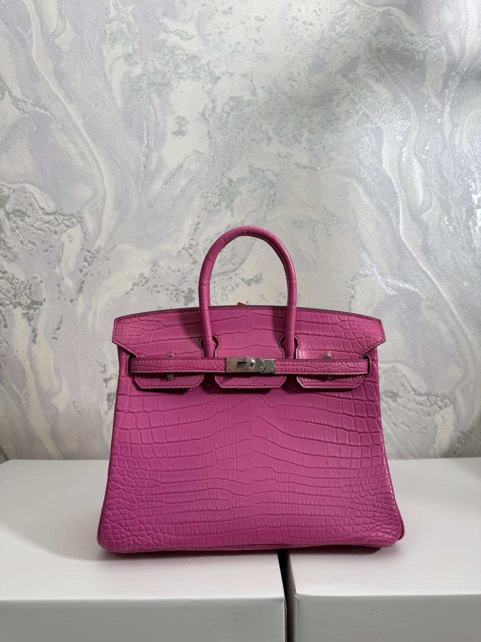 Herm**s crocodile bags.