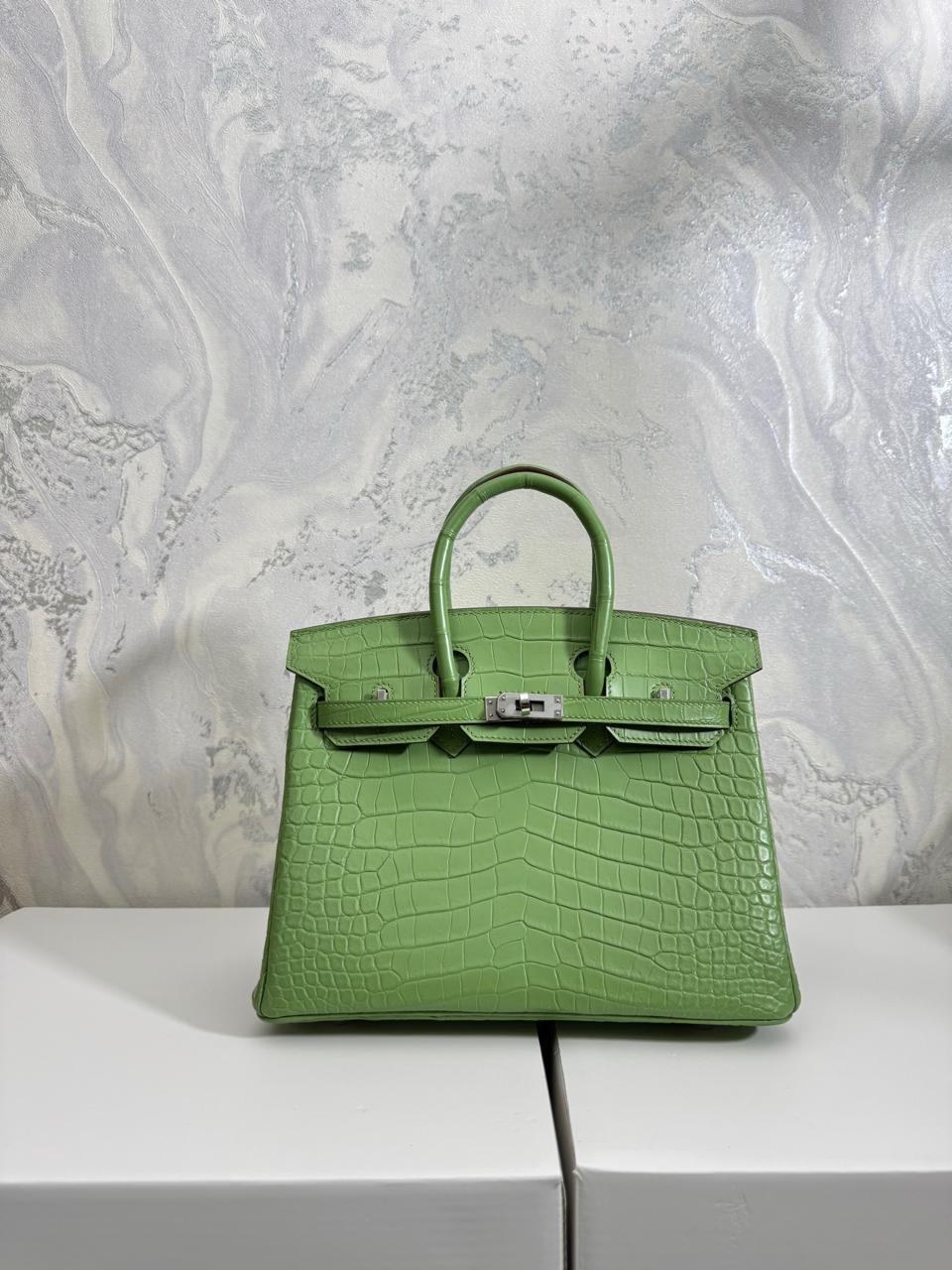 Herm**s crocodile bags.