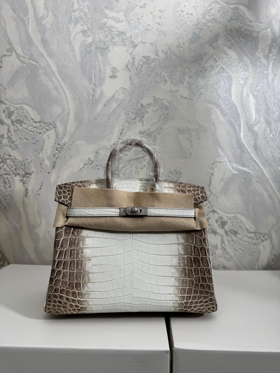 Herm**s crocodile bags.