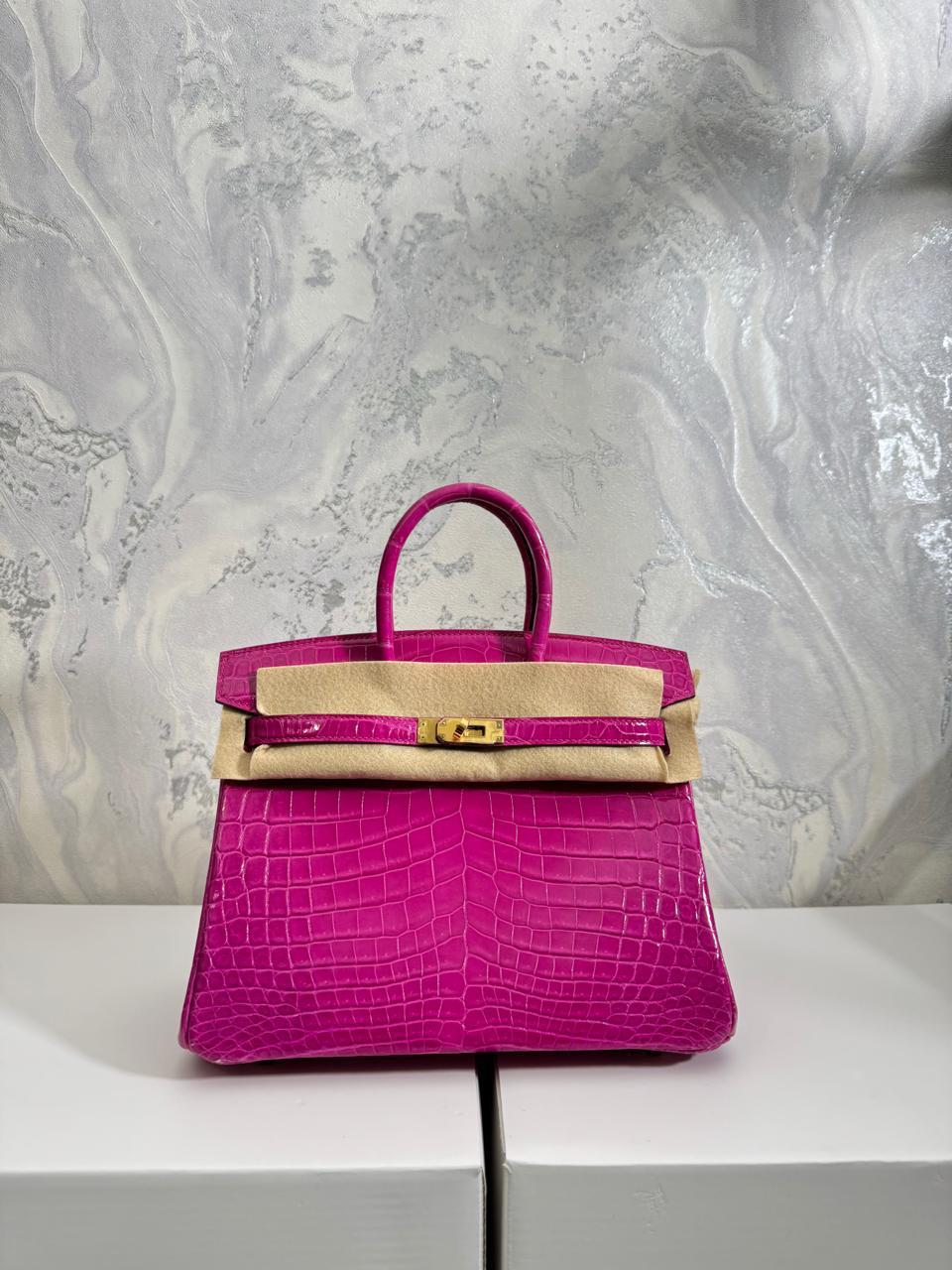 Herm**s crocodile bags.