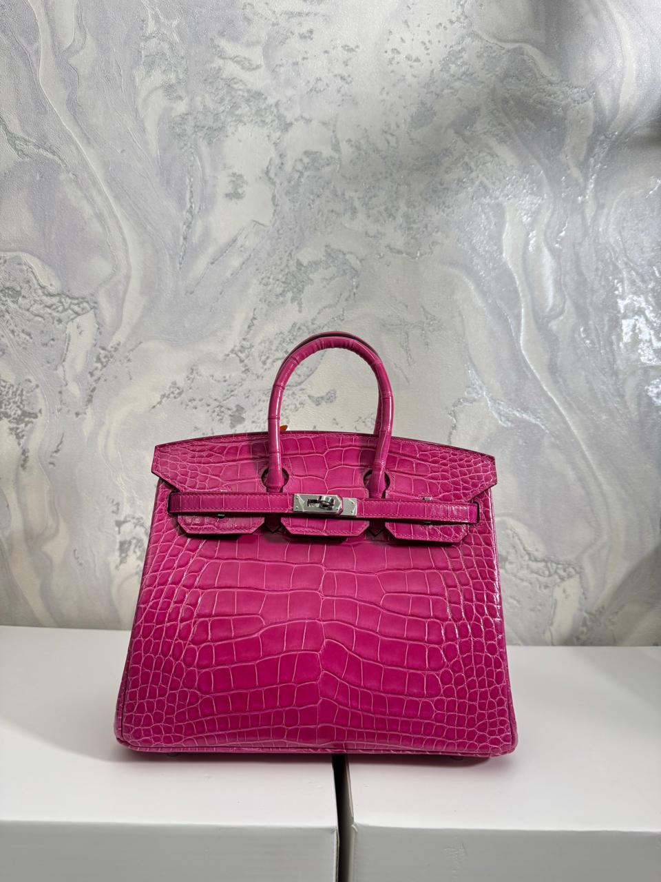 Herm**s crocodile bags.