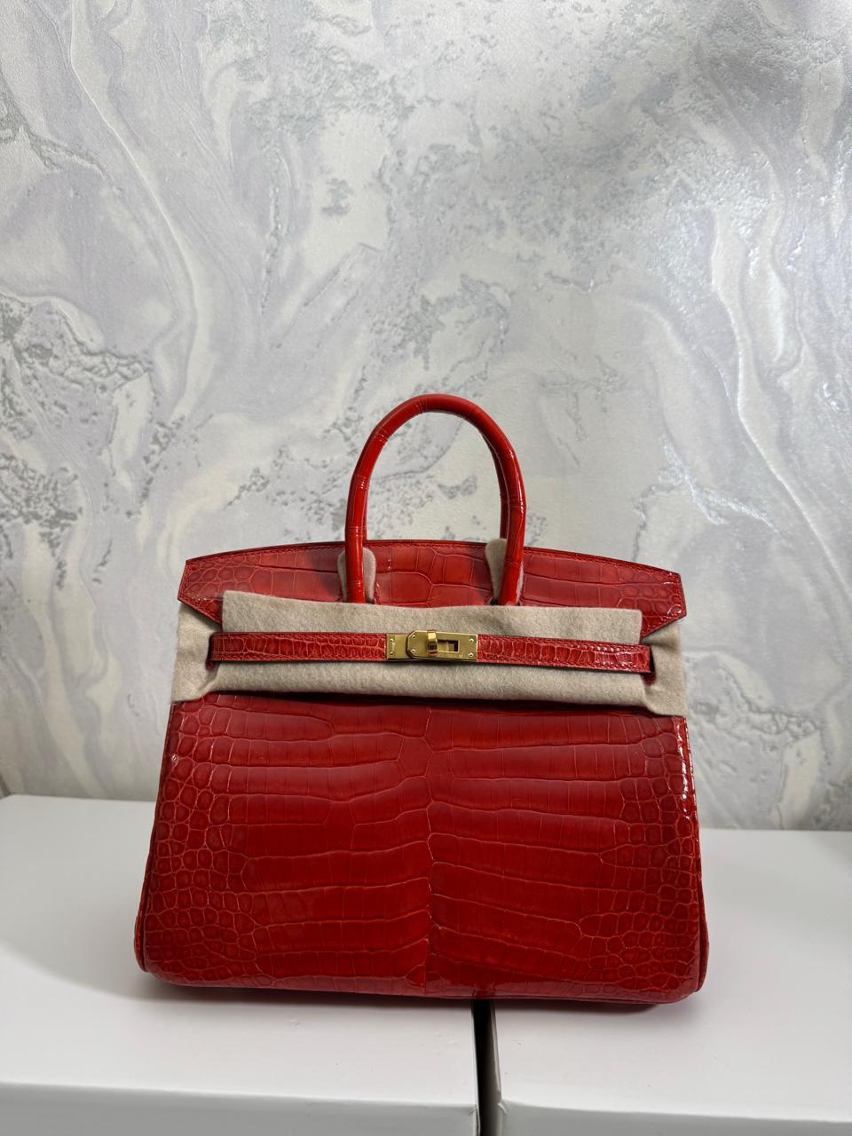Herm**s crocodile bags.