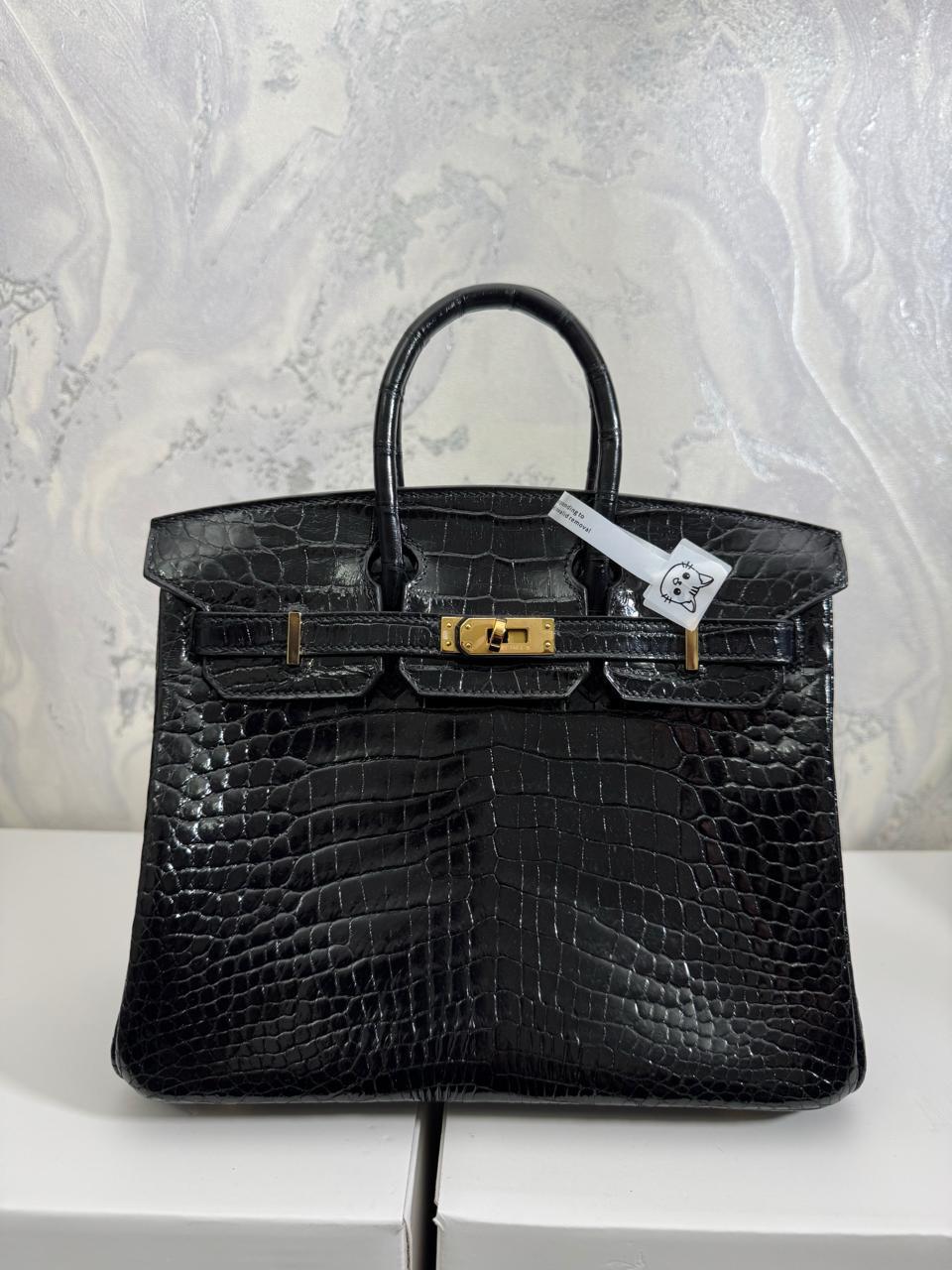 Herm**s crocodile bags.